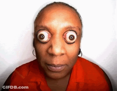Woman With Big Eyes In Red Shirt GIF
