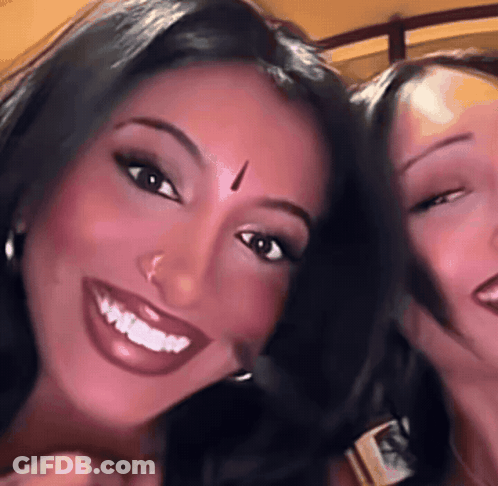 Woman With Bindi Smiling Beside Another Woman GIF