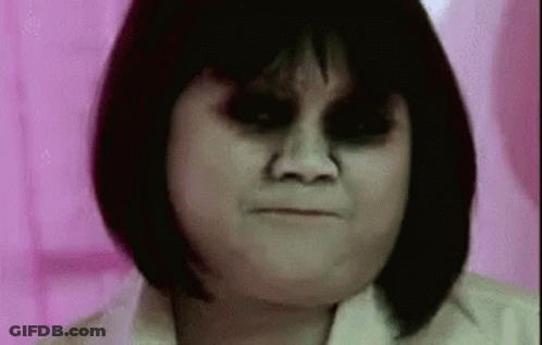 Woman With Black Eyes And Short Hair Close Up GIF