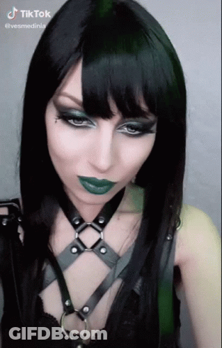 Woman With Black Hair And Green Lipstick TikTok Watermark GIF