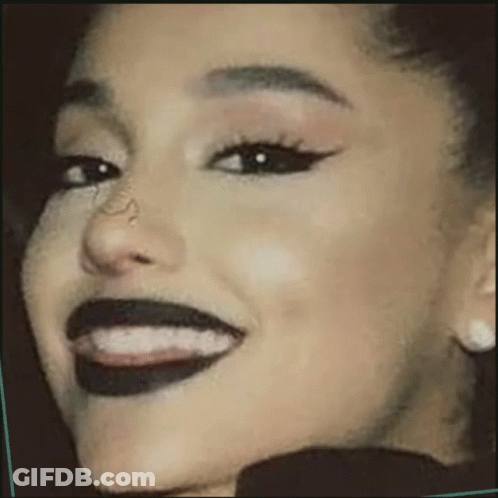 Woman With Black Lipstick And Earrings GIF