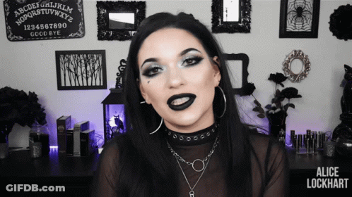 Woman With Black Lipstick At Ouija Board GIF