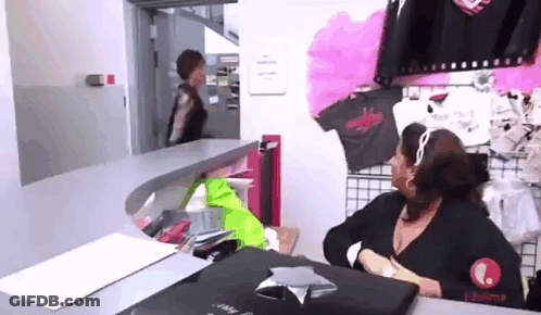 Woman With Black Purse In Theater GIF