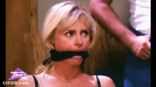 Woman With Black Scarf Held By Man GIF