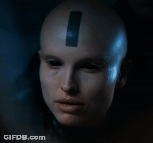 Woman With Black Stripe On Forehead Looking At Camera GIF