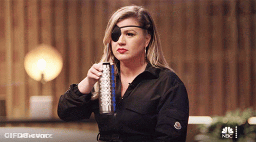 Woman With Blindfold Holding Soda And Water Bottle GIF