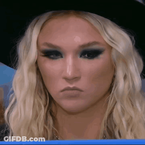 Woman With Blonde Hair And Black Hat GIF