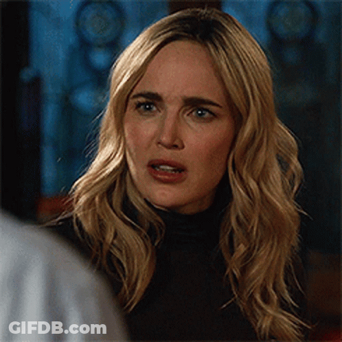 Woman With Blonde Hair And Black Turtleneck GIF
