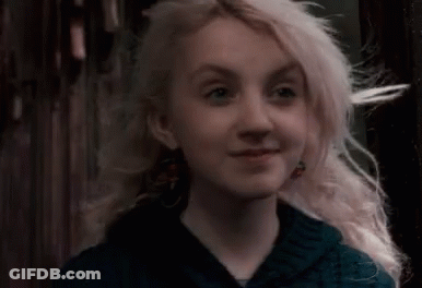 Woman With Blonde Hair And Blue Shirt GIF
