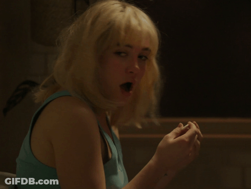 Woman With Blonde Hair And Blue Tank Top Surprised GIF