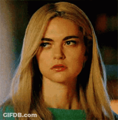 Woman With Blonde Hair And Green Sweater GIF