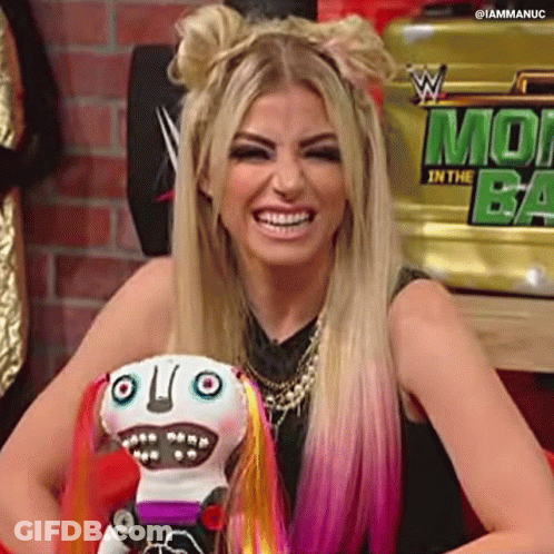 Woman With Blonde Hair And Pink Highlights Smiling Holding Stuffed Animal GIF