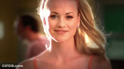Woman With Blonde Hair And Red Headband Smiling GIF