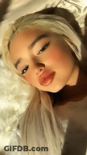 Woman With Blonde Hair And Red Lips Close Up GIF