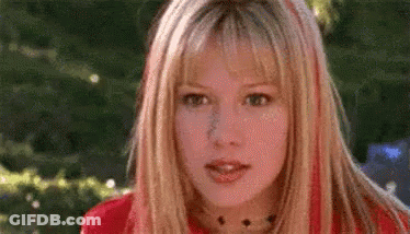 Woman With Blonde Hair And Red Streaks GIF