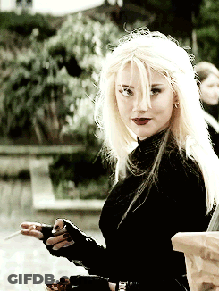 Woman With Blonde Hair In Black Top GIF