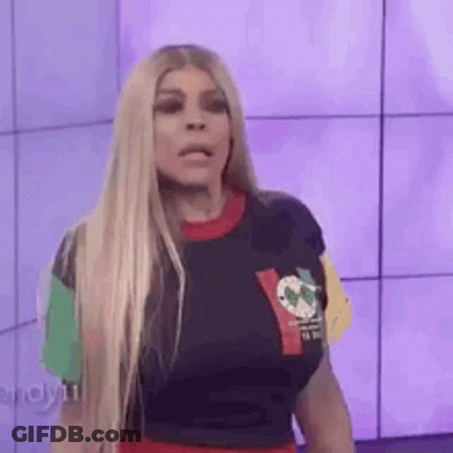 Woman With Blonde Hair In Colorful T-Shirt And Red Skirt GIF