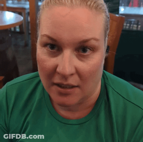 Woman With Blonde Hair In Green Shirt GIF