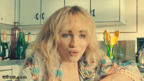 Woman With Blonde Hair In Kitchen GIF