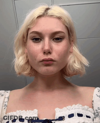 Woman With Blonde Hair In White Lace Dress GIF