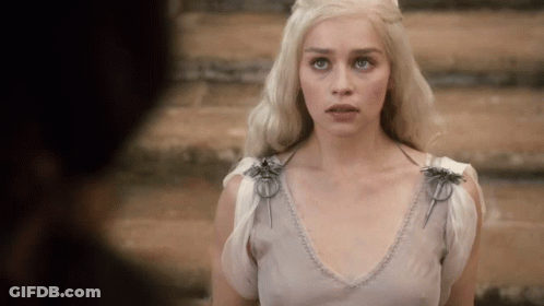 Woman With Blonde Hair In White Top GIF