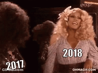 Woman With Blonde Hair Laughing Next To Man With Curly Hair GIF