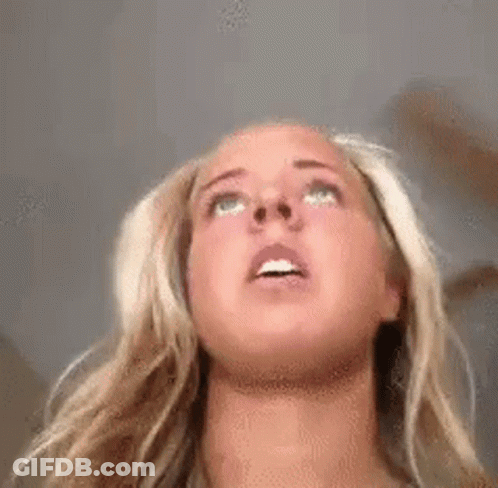 Woman With Blonde Hair Looking Up GIF