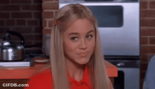 Woman With Blonde Hair Making Funny Face GIF