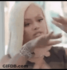 Woman With Blonde Hair Making Funny Face GIF
