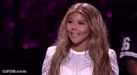 Woman With Blonde Hair Smiling On Stage GIF