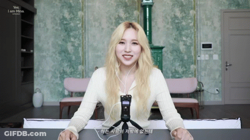 Woman With Blonde Hair Smiling Wearing Headphones GIF