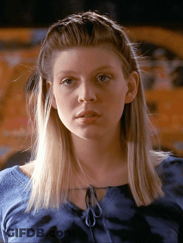 Woman With Blonde Hair Wearing Blue Shirt GIF