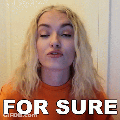 Woman With Blonde Hair Wearing For Sure Orange Shirt GIF