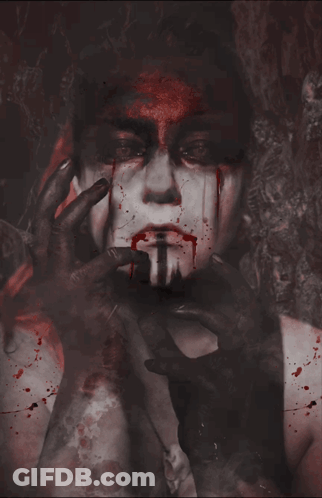 Woman With Blood On Face Holding Hands To Mouth GIF