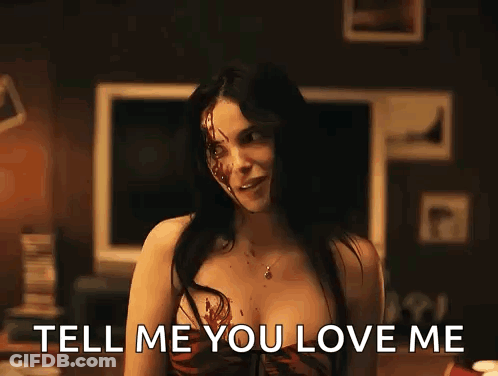 Woman With Blood On Face In Front Of TV GIF