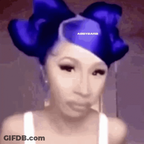 Woman With Blue Bow In Hair Wearing White Tank Top GIF