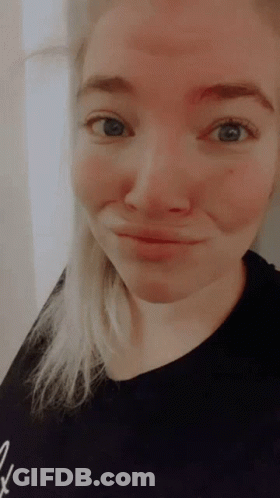 Woman With Blue Eyes And Black Shirt GIF