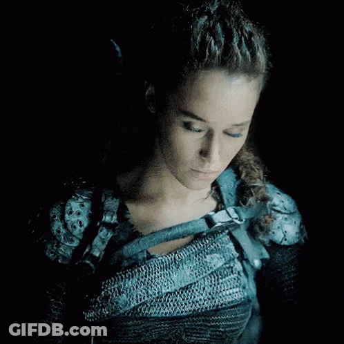 Woman With Blue Eyes In Chain Mail Armor GIF