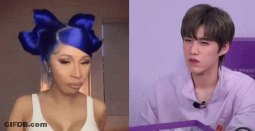 Woman With Blue Hair And Bow Beside Man In Purple Shirt GIF