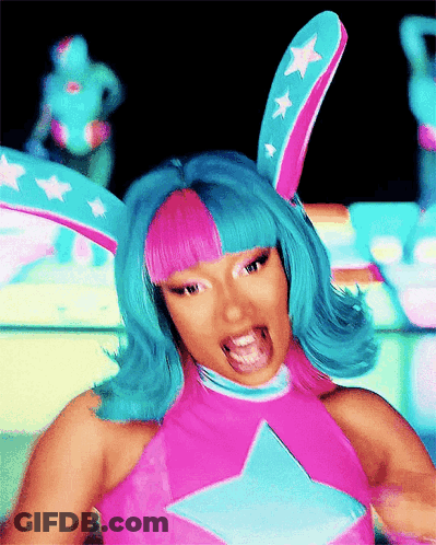 Woman With Blue Hair And Bunny Ears In Pink Star Top GIF