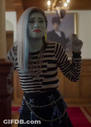 Woman With Blue Hair And Striped Shirt Before Man Portrait GIF