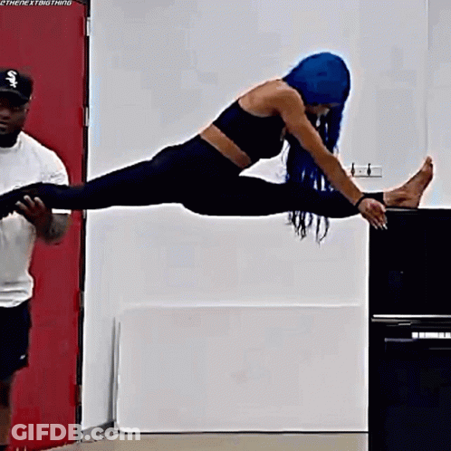 Woman With Blue Hair Doing Split GIF