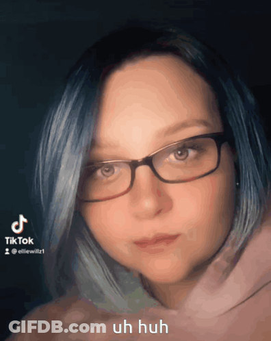 Woman With Blue Hair Glasses And Pink Hoodie GIF
