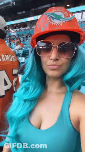 Woman With Blue Hair Hard Hat Sunglasses At Dolphins Game GIF