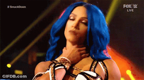 Woman With Blue Hair Held By Man On Stage GIF