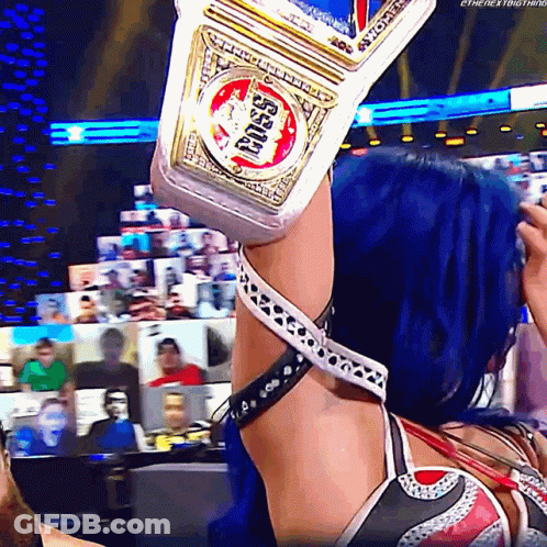 Woman With Blue Hair Holding Championship Belt GIF
