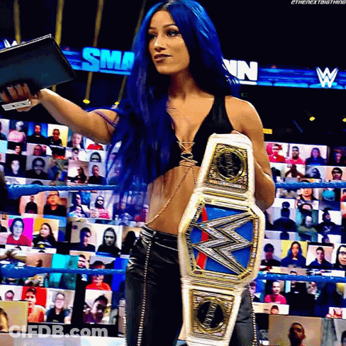Woman With Blue Hair Holding Championship Belt GIF