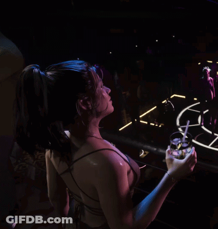 Woman With Blue Hair Holding Drink In Front Of Sign Saying N GIF