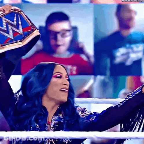 Woman With Blue Hair Holding Wrestling Belt GIF