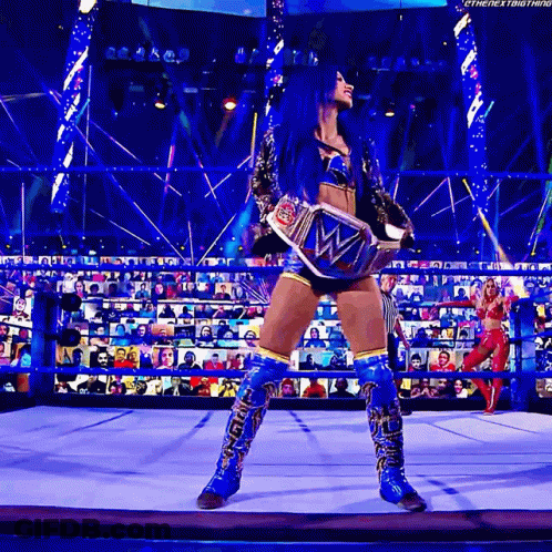 Woman With Blue Hair Holding Wrestling Championship Belt GIF